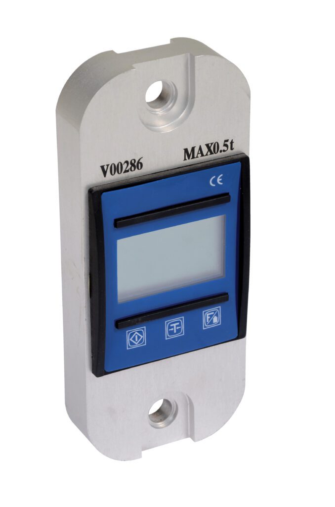 DLI-1_A.jpg The Vestil Digital Load Indicator 1000 Lb has a rectangular blue display, control buttons below, is mounted on a sturdy metal bracket with two screw holes, and labeled V00286 and MAX0.5t, ensuring precise measurements.