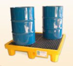 Two blue industrial barrels sit on a Vestil Ultra Spill Pallet Four Drum with Drain, featuring a yellow base and black grid surface, ensuring safety and spill prevention in industrial settings against a plain, light background.