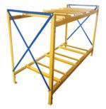 The yellow metal Vestil Horizontal Drum Storage Rack 3W X 2H features six horizontal beams and two diagonal blue crossbars on each side, providing a sturdy and simple open design ideal for storage or industrial use.