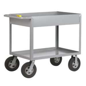 A gray, two-shelf metal utility cart, akin to the Little Giant Cushion Load Deep Shelf Truck, with four black rubber wheels and a maneuvering handle. The raised-edge top shelf ensures items stay secure. Its empty and set against a white background.