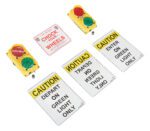 The Vestil Traffic System Stop Go Set 12V LED includes two signal lights—red and green—above three caution signs that read: Depart On Green Light Only, Caution Enter On Green Light Only, and Caution Chock Your Wheels.