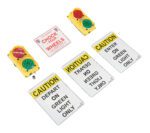 The Vestil Traffic System Stop Go Set 24V LED features several caution signs and two traffic lights on a white background. The signs display CHECK YOUR WHEELS, CAUTION DEPART ON GREEN LIGHT ONLY, and CAUTION ENTER ON GREEN LIGHT ONLY with red and green LED lights.