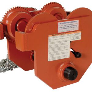 The Vestil Eye Manual Trolley Geared 10K Capacity showcases an orange industrial hoist with visible gears, chain, and a manufacturers label. It offers sturdy construction and a prominent warning label for safe heavy lifting.