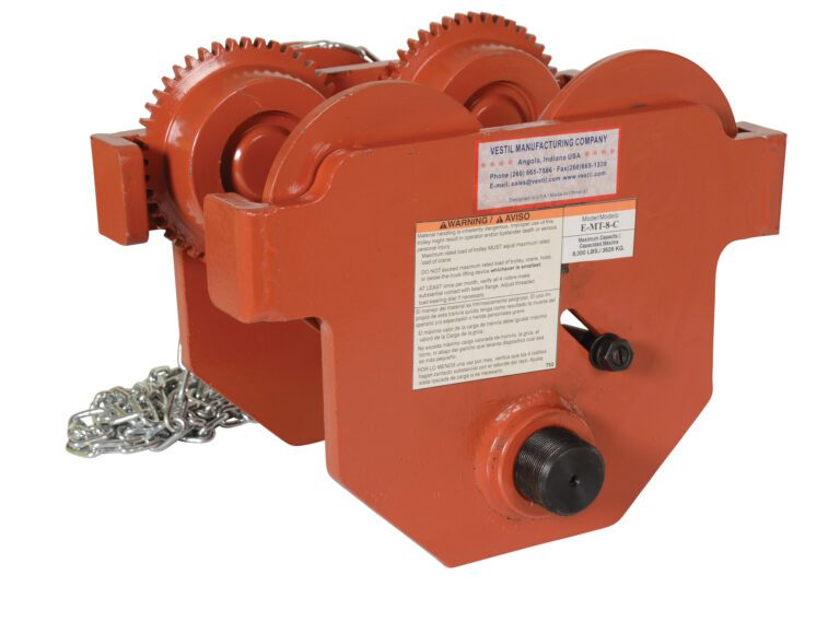 E-MT-8-C_A.jpg The Vestil Eye Manual Trolley Geared 8K Capacity is an orange industrial hoist trolley featuring two sets of gear wheels and a metal chain. It includes a safety warning label with manufacturer contact info and has a sturdy, compact design ideal for heavy-duty tasks.