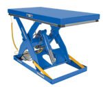 The Vestil Electric Hydraulic Lift Table 3K 36X72 boasts a rectangular platform and strong hydraulic system, plus a yellow safety strip on the base. A coiled cable securely attached to the side enhances operational efficiency.
