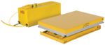 A Vestil Work Station Scissor Lift 1.5K 24 X 36 in yellow features a flat platform, a connected power unit with a coiled yellow cable, and has a capacity of 1500 lbs.