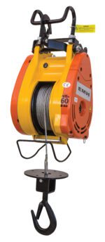 The Vestil Electric Mini Hanging Cable Hoist 300Cap, featuring yellow and orange colors, has a metal cable on a spool with a black hook. It’s labeled EMH and 60, with a top safety warning tag.