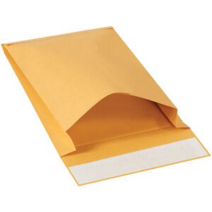 The 9 x 12 x 2 Kraft Expandable Self-Seal Envelopes (250/Case) are shown partially open, displaying the adhesive strip on the flap. Set against a plain white background, these sturdy brown mailers are ideal for mailing needs.