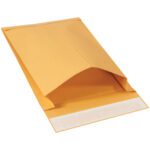 The 9 1/2 x 13 x 2 Kraft Expandable Self-Seal Envelopes (250/Case), highlighted against a white backdrop, display durable construction. The opened flap shows a white adhesive strip, demonstrating the envelopes capacity and durability.