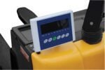 The Vestil Elec Pallet Truck 3K-25X47 Scale (2)12V features a yellow control panel with a digital screen, green and blue icons for power and navigation, plus a lever and black protective cover enhance the functionality of this robust machinery.