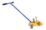 The Vestil Fork Truck Fork Caddy has a 300 lb capacity and features a blue steel handle with a black grip. It connects to a yellow triangular dolly with two wheels, adjustment knobs, a small red caster, and metal assemblies for height adjustments.