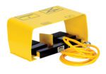 The Vestil Optional Two Pedal Foot Control 8’ Cord includes a yellow foot pedal with cover, two labeled black pedals for function control, and an 8’ spiral cable neatly coiled alongside the device.