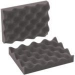 Two pieces of MH-USA 8 x 6 x 2 Charcoal Convoluted Foam Sets, from a case of 48 sets, feature a wavy textured surface. Angled to highlight their design, these acoustic foam sets effectively absorb sound and reduce noise.
