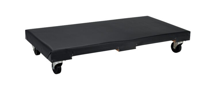 The Vestil Hardwood Dolly Vinyl Cover 1.2K 24 X 48 features a low-profile rectangular design with four swivel caster wheels, a cushioned vinyl cover, measures 24 x 48 inches, and holds up to 1.2K lbs, making it ideal for moving heavy or bulky items in warehouse or industrial settings.