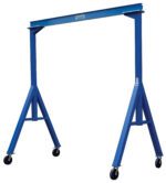 The Vestil Fixed Height Stl Gantry Crane 4K 10 Ft features a blue rectangular frame with four wheels, two vertical support beams linked by a horizontal beam, and angled legs for stability, reaching up to 10 ft in height.