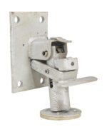 A metallic hinge with a square plate with four mounting holes is attached to a cylindrical base, similar to the Vestil Floor Lock 7 to 8-3/16 In Height. The hardware displays wear and age, featuring a slightly rustic finish.