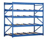 The Vestil Carton Flow Rack 48 In Length 4 Levels is a sturdy blue shelving unit equipped with yellow rollers for easy sliding of items. It measures 48 inches and has four slanted levels, enhancing accessibility, making it perfect for warehouse or storage use.