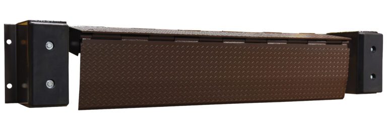 The rectangular brown dock leveler, like the Vestil Mechanical Edge-O-Docklevelers 30K 72 In, features a textured non-slip surface and is secured on a robust black metal frame with heavy-duty bumpers for extra protection.