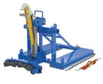 A blue industrial Vestil Eagle Beak Drum Lifter with a hydraulic cylinder and 3 saddle rollers, flat base, and upright supports, designed for lifting or stabilizing heavy loads efficiently, is situated beside chains.
