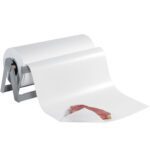 A partially unrolled roll of MH-USA 15 - Freezer Paper (1100/Roll) is on a metal stand, with raw meat placed on the extended sheet.