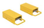 Two yellow rectangular metal blocks with handles, resembling the Vestil Fork Rear Spacer 5 In Width, each showing a partially visible blue and gray element inside, are side by side on a white background.