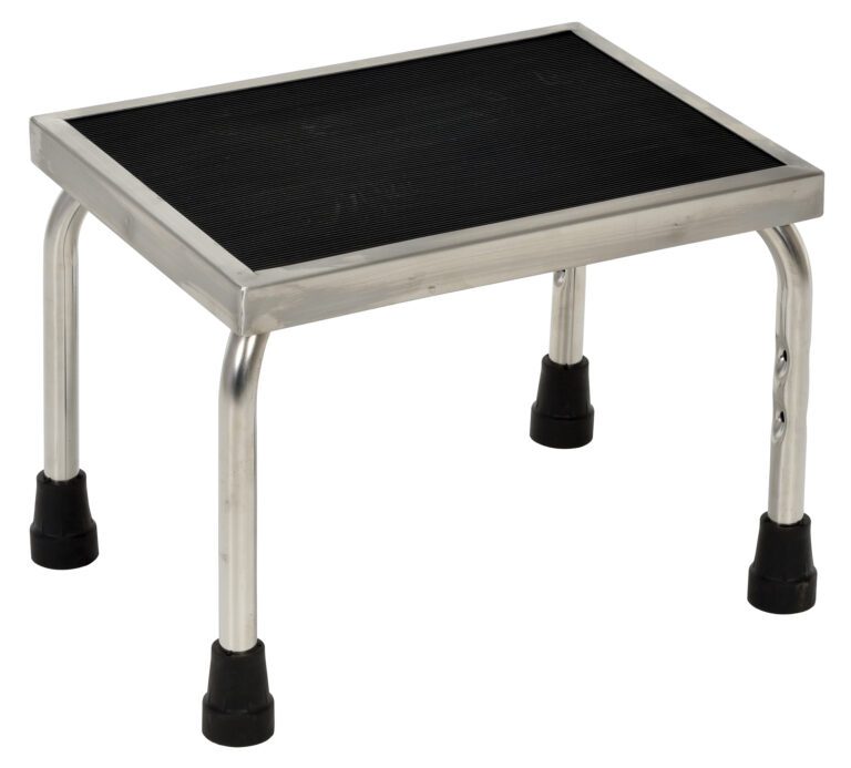 FT-SS-1_A.jpg The Vestil Stainless Steel Foot Stool is a compact, rectangular step stool with a black non-slip surface. It features four silver metal legs, each capped in black plastic to ensure stability.
