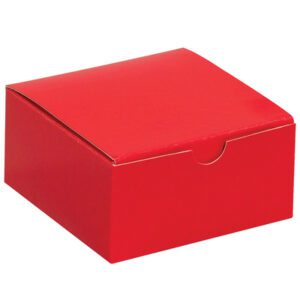 An MH-USA 4 x 4 x 2 holiday red gift box, closed with a small notch on the front edge, sits elegantly against a plain white background.