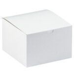 A plain white cardboard box with a closed lid against a white backdrop. The MH-USA 6 x 6 x 4 White Gift Boxes (100/Case) are square and simple, featuring a small notch on the front for easy opening.