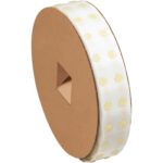 A large roll on a brown cardboard spool features 1/4 Dot Shot® circles in cream, with a super high tack glue stitch and triangular cutout, evenly spaced on a white strip; this low profile product contains 3000 per roll.
