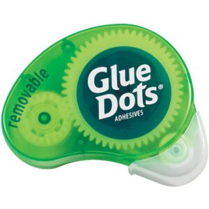 The Dot N Go® Removable Glue Dots® Dispenser (6/Case) has a clear plastic edge displaying its inner workings. The green dispenser, labeled Glue Dots, offers effortless removal for your projects.