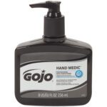 The GOJO® Hand Medic® Skin Conditioner - 8 oz. (6/Case) features a sleek black pump with a gray label, perfect for moisturizing hardworking hands and essential for professional environments.