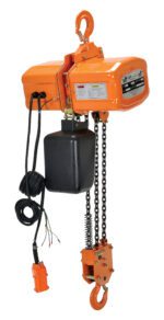 The Vestil Econ Chain Hoist W/ Container 6K 3 Phase features an orange motor housing with a top hook, a black control box, and a wired remote for smooth operation. Its durable chain and lower hook ensure reliable lifting for 3-phase power applications, all compactly stored in a convenient container.