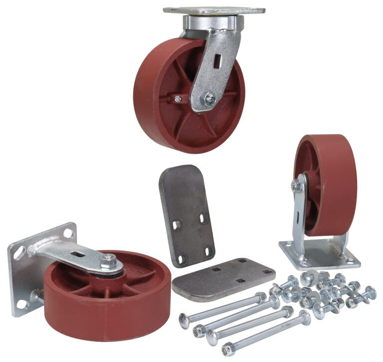 The Vestil 6X2 Ductile Steel Caster Kit 6K includes four red caster wheels with sturdy metal mounts and installation hardware like bolts and plates, all set against a white background. One wheel is elevated on its mount to display the underside.