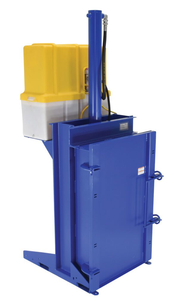The Vestil Crusher/Compactor 208V is a blue industrial hydraulic machine with a yellow and white housing, featuring a vertical cylinder and sturdy metal doors with latches. Made primarily from steel, its ideal for compressing materials due to its durable, utilitarian design.