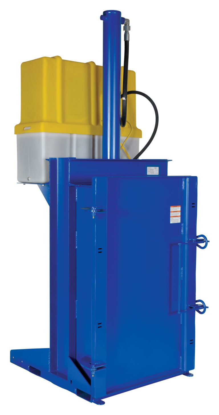 The blue industrial baler, resembling the Vestil Crusher/Compactor 460V, has a yellow and gray top, vertical hydraulic cylinder, rectangular chamber for compressing materials into bales, and various levers and connectors for efficient operation.