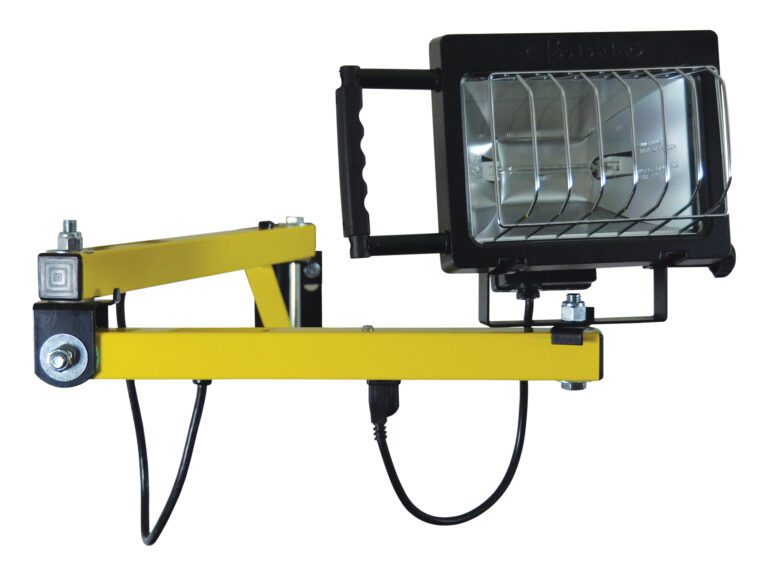 The Vestil Double Arm Strut Halogen Light has a portable design with a sturdy black handle on a yellow adjustable arm, a metal grille cover, and an electric cord at the base. Its bolted joints allow for flexible positioning.