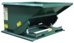 A large, green, industrial metal dumpster with a sloped front and flat bottom sits on a sturdy metal base, its caution labels evoking the Vestil Self-Dump Light Duty Hopper 1.5 Cu Yd 2K, designed for heavy-duty waste handling.
