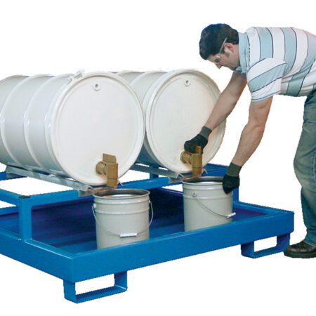 Wearing a striped shirt and gloves, a person dispenses liquid from two large white barrels on a Vestil Horizontal Retention Basin 1200Lb - Blue into smaller buckets below, efficiently handling the transfer.