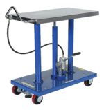 The Vestil Hydraulic Air Post Table 2K Lb 24 X 36 is a sturdy blue lift with a rectangular metal platform, pump handle, a black hose for seamless operation, and four wheels (two with red casings) for mobility.