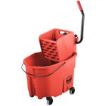 The Rubbermaid® WaveBrake® 35 Quart Bucket/Wringer in red features a built-in wringer, sturdy black handle, glides smoothly on four black wheels, and displays a Caution Wet Floor symbol for safety.