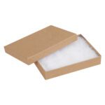The 5 1/4 x 3 3/4 x 7/8 Kraft Jewelry Boxes are open rectangular brown cardboard boxes with separate lids, white cotton padding inside, and a classic design. Sold in cases of 100, they are perfect for showcasing your finest pieces.