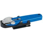 A blue handheld can opener with a sleek design and metallic blade pairs elegantly with a UKH-545 Safety Holster, resting securely on its black base.