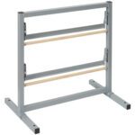 The MH-USA 24 Double Roll Horizontal Paper Cutter has a sleek gray metal storage rack with flat feet, two sturdy metal bars, and light wooden rods arranged horizontally, all supported by strong vertical metal frames for efficient use.
