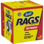 The Scott® Rags In A Box (1600/Case) come in a yellow and red box with All-Purpose labeled, featuring Strong and Absorbent attributes with 200 towels per box. An illustration shows a hand pulling out a towel. Available for large-scale needs.