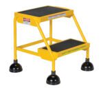 The Vestil Spring Loaded Roll Ladder 2 Step Yellow is designed for stability with black rubber-tipped legs, has black anti-slip steps, and includes safety warnings and Safety First messaging to prioritize user protection.