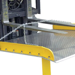 The Vestil Steel Dockboard Opt Lifting Chains 84 In, with yellow edges and a silver diamond pattern, rests securely on the loading platform as the forklifts forks cradle it.