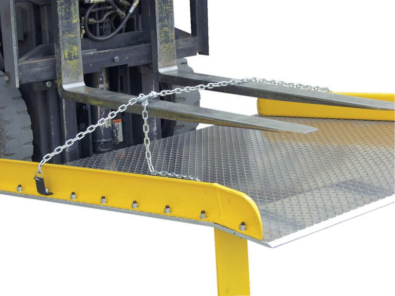 The Vestil Steel Dockboard Opt Lifting Chains 84 In, with yellow edges and a silver diamond pattern, rests securely on the loading platform as the forklifts forks cradle it.