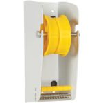 The MH-USA 3 wall-mounted label dispenser has a modern design with a supportive metal bar. Its vibrant spool efficiently stores labels, and the lower section provides space for accessories.