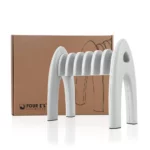 A white, curved, multi-slot test tube rack is in front of a brown cardboard box. The box has a simple outline drawing of the rack and the logo Four Es Scientific printed on it.