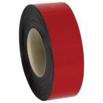 A roll of MH-USA 2 x 50 red warehouse labels, with a black interior coil and cardboard core, stands upright on a white background, showcasing order and efficiency like magnetic rolls in warehouses.